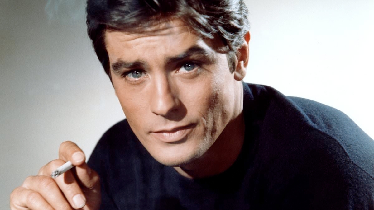 Revealed in a shocking new book a year after the death of French screen legend Alain Delon... My father was 'the most beautiful man in movie history' – but he also beat up my mother and pointed a gun at me