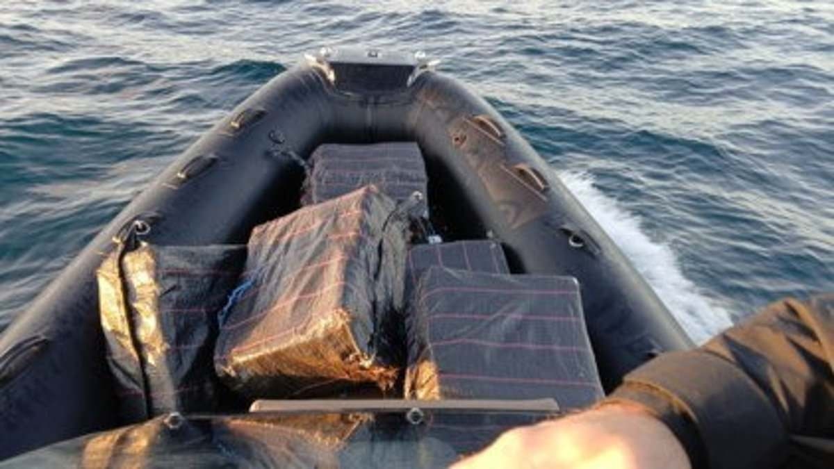 Incredible moment boat with £18m of cocaine crashes onto beach after being chased for 28 miles at sea by 'Britain's FBI'