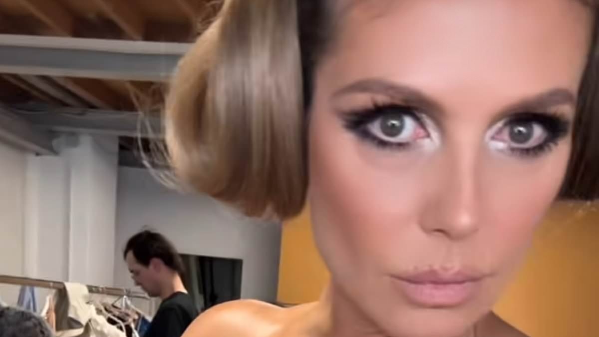 Heidi Klum, 52, goes topless as she strips off for raunchy fitting room selfie