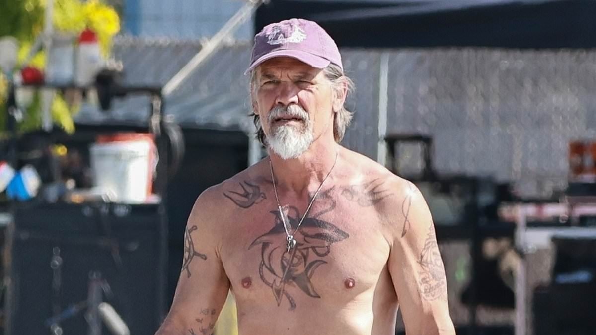 Josh Brolin shows off his massive fake tattoos on set after removing his real ink