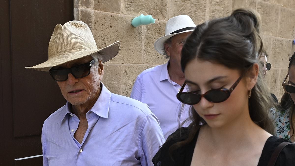 Dapper Michael Douglas, 80, is joined by his chic daughter Carys, 22, as they step out together in Menorca after her graduation