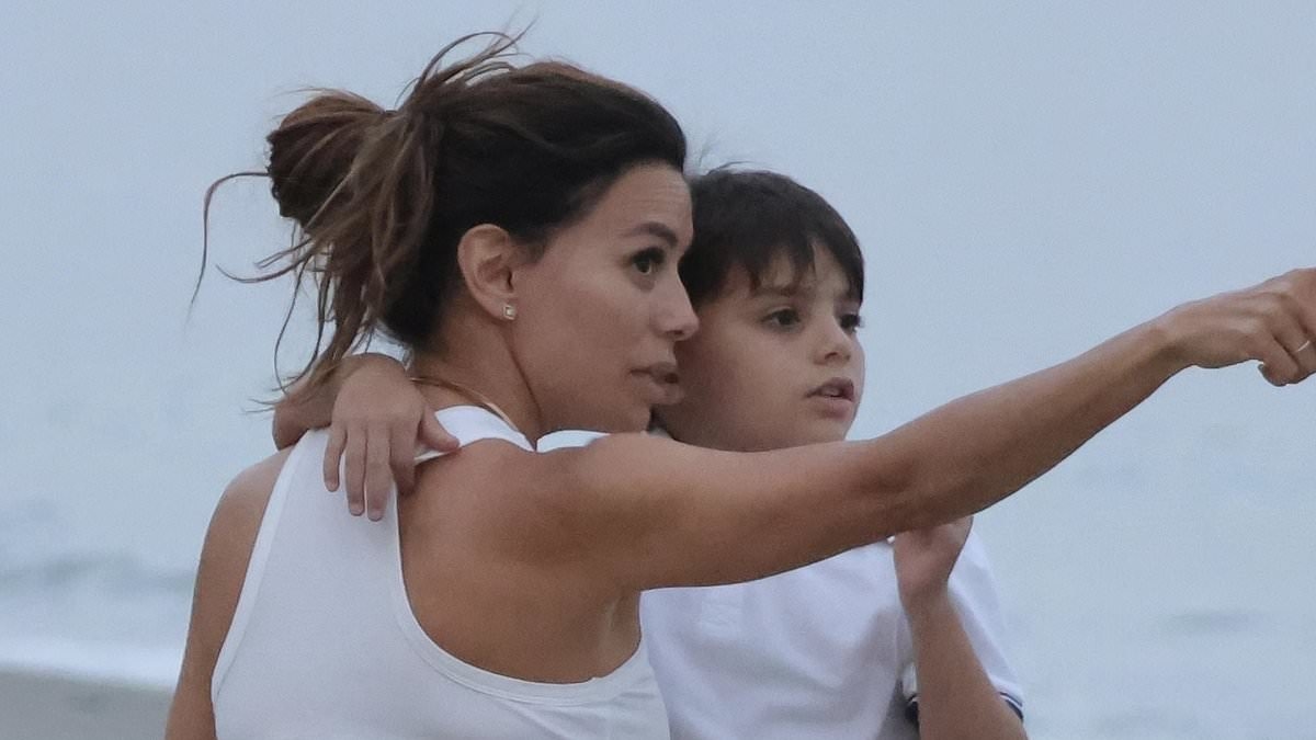 Eva Longoria, 50, is every inch the doting mother as she spends quality time with her son Santiago, 7, on the beach in Marbella