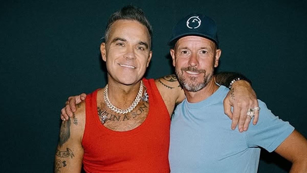 Ex-Man United boss Erik ten Hag meets Robbie Williams after attending the popstar's gig in Amsterdam as he enjoys his summer before starting work at Bayer Leverkusen