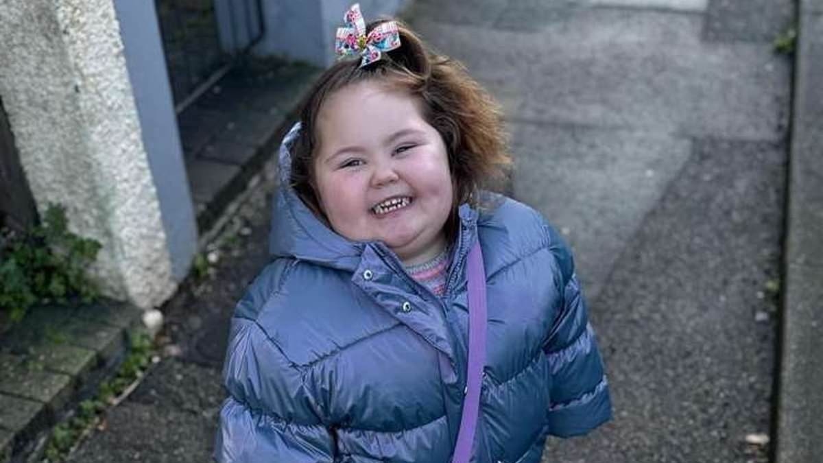 Woman is charged after toddler's arm ripped open in dog attack outside primary school