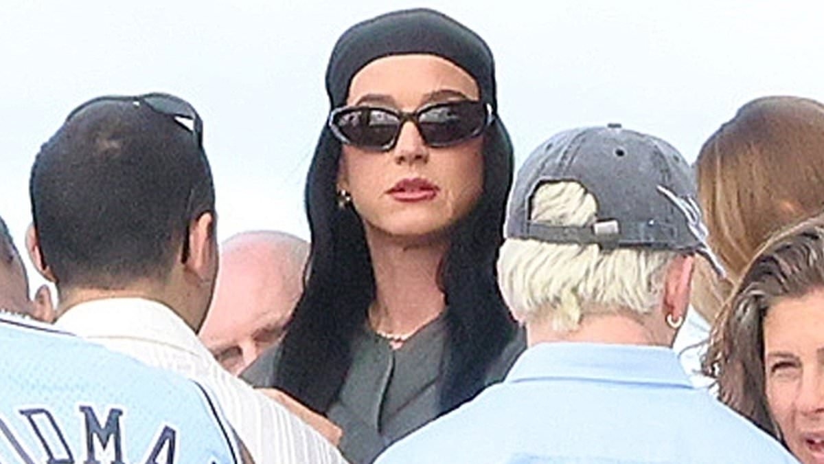 Katy Perry looks downcast on a boat with her dancers in Perth without Orlando Bloom amid split rumours - as he is set to debut as a single man at Jeff Bezos' wedding
