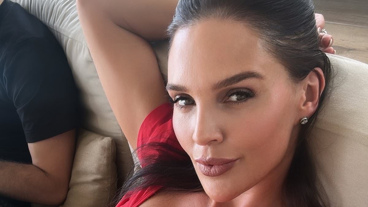 Danielle Lloyd showcases her toned abs in a bright red frilly bikini top after revealing she lost two stone following shock cancer diagnosis