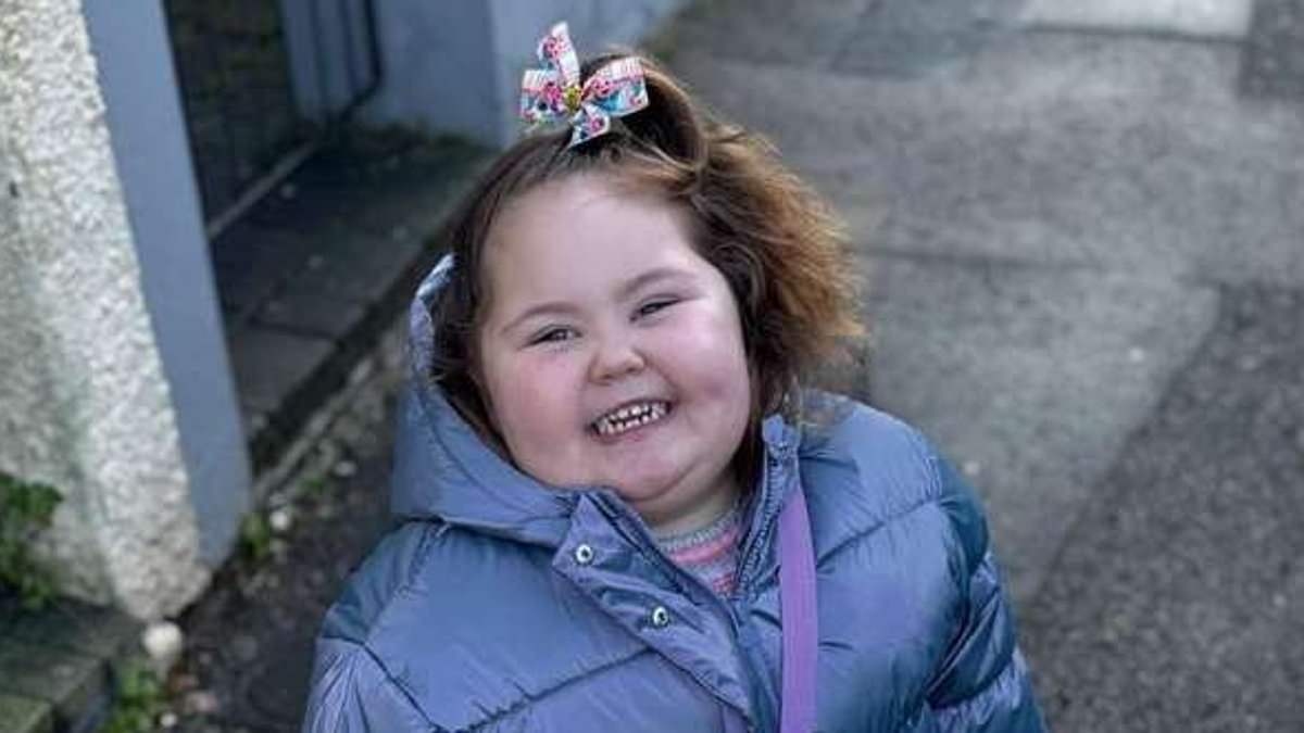Woman, 50, is charged after cockapoo dog mauled three-year-old girl in attack that forced father to 'hold her skin together'