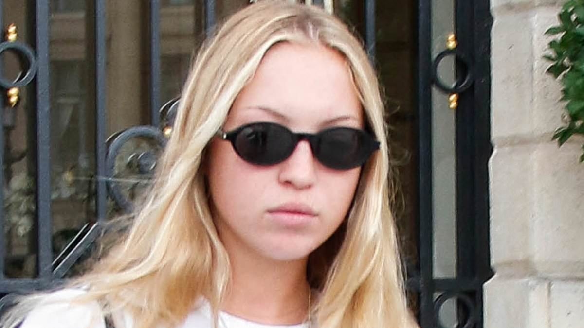 Lila Moss covers up in a casual T-shirt and baggy jeans look while out in Paris - a day after channeling her model mum Kate in a racy sheer top