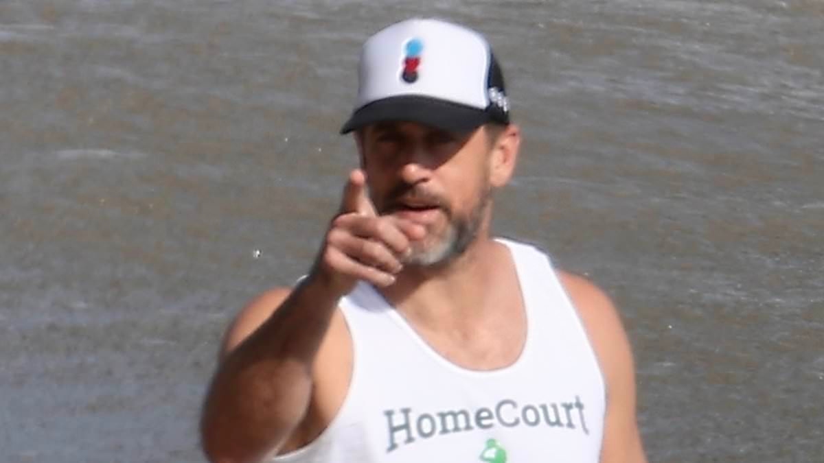 New photo of furious Aaron Rodgers flipping off paparazzi emerges after rant about 'fake marriage' rumors