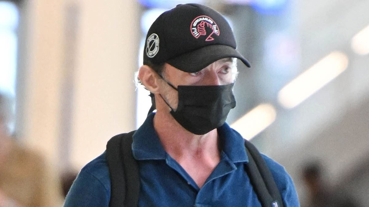 Hugh Jackman appears sombre as he is seen for the first time since finalising his high-profile divorce from Deborra Lee-Furness