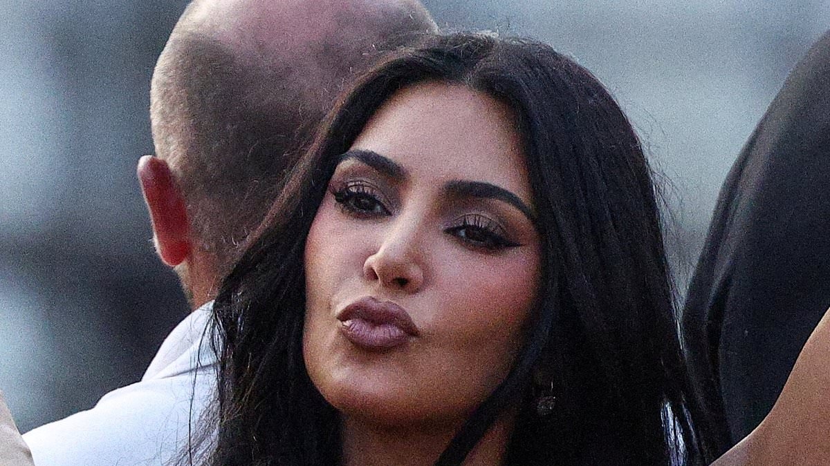 Awkward! Kim Kardashian poses for photo taken by sister Khloe... but there is a hilarious catch