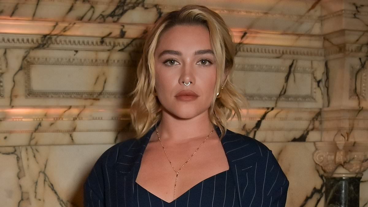 Florence Pugh flashes her toned midriff in a navy pinstripe co-ord before posing with Will Poulter at bash celebrating Coach's creative director