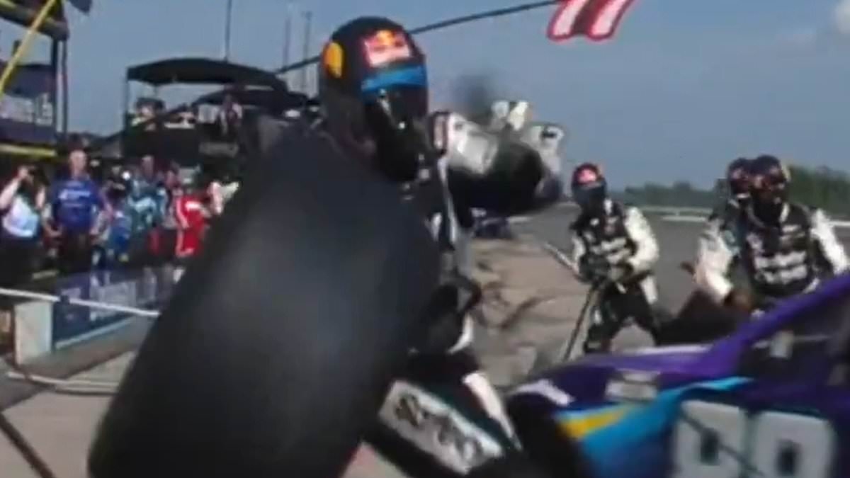 Shocking moment NASCAR mechanic is struck by a flying tire during pit stop