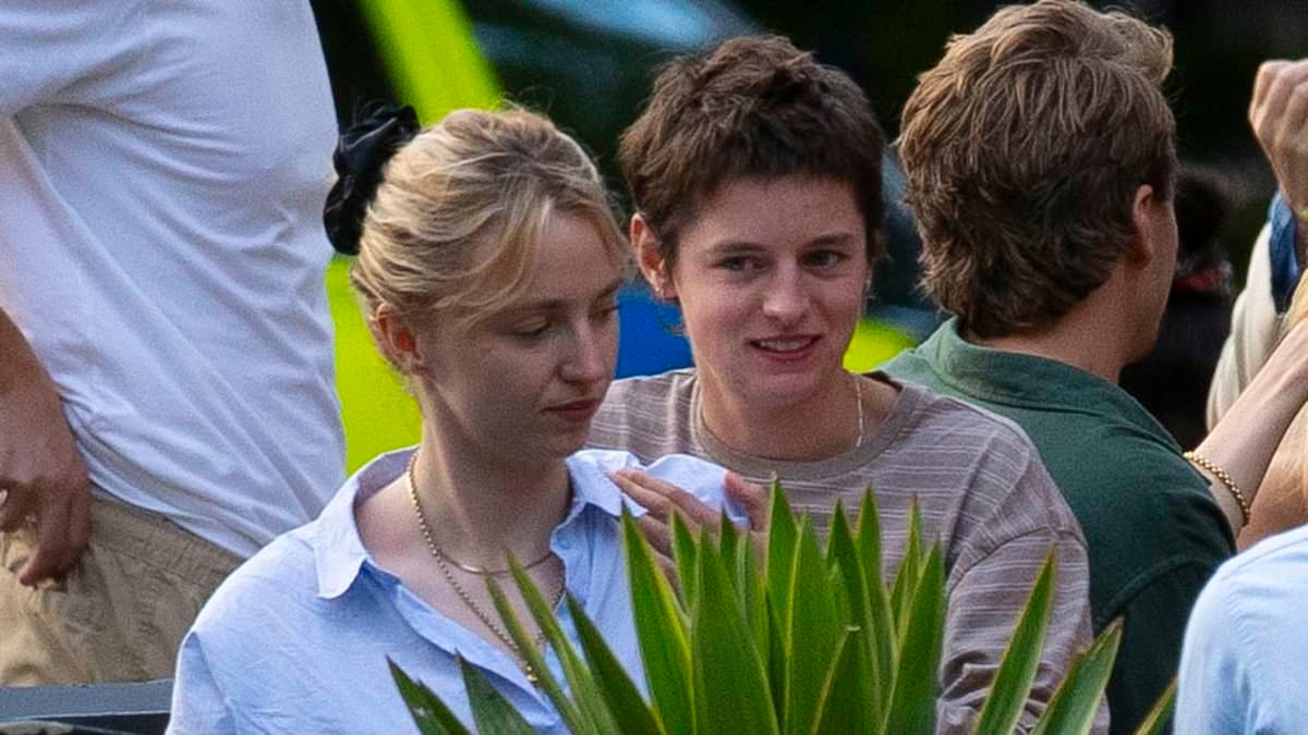 Emma Corrin gives their friend a massage during an evening out at the pub following split from Rami Malek