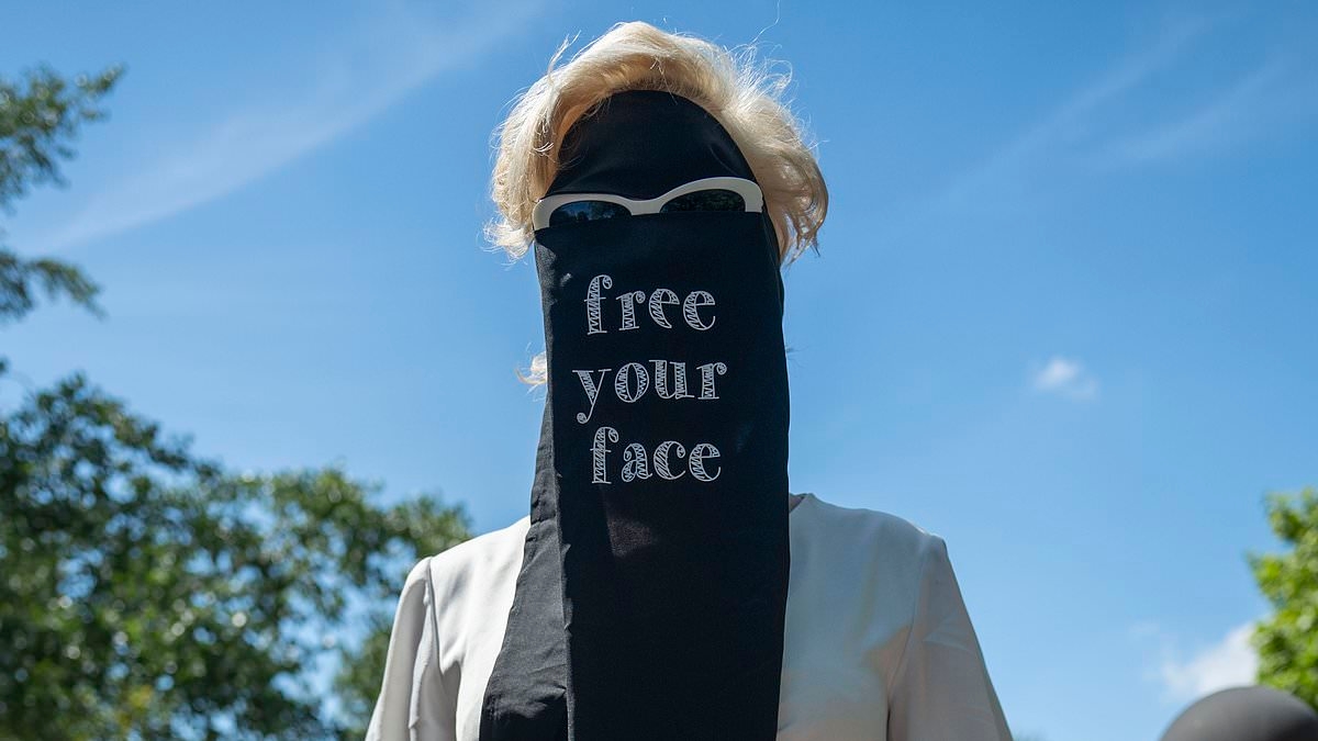 EXCLUSIVE Moment crowd of women's rights campaigners dressed in Niqab-style veils ripped them off to declare 'free your face' in provocative London protest