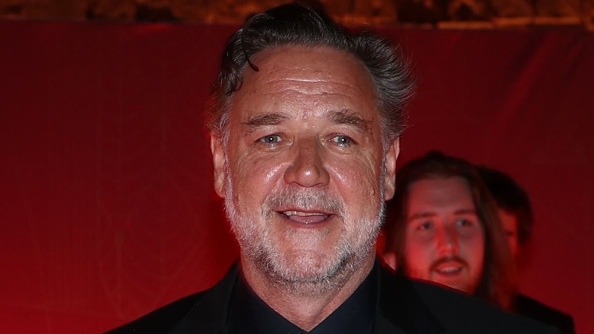 Russell Crowe shows off his dramatic weight loss as he arrives at the Golden Bee Awards in Malta with fiancée Britney Theriot
