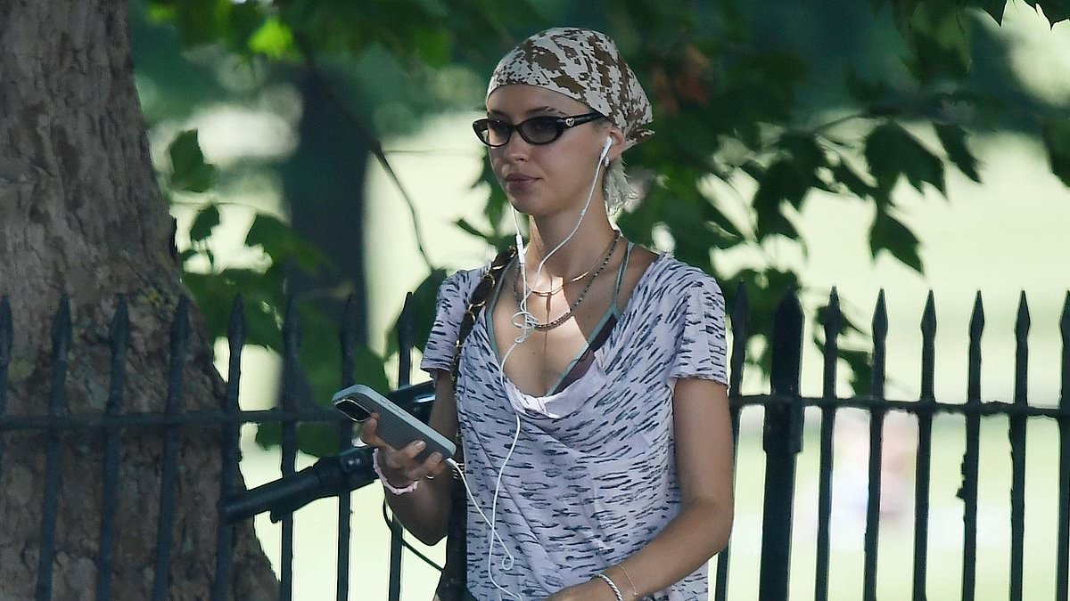 Iris Law shows off her lithe legs in tight-fitting shorts as she makes the most of British 'heat dome' - after confirming her relationship status