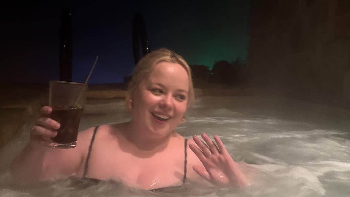 Nicola Coughlan, 38, takes a dip in a hot tub during romantic trip with her boyfriend Jake Dunn, 25, to Australia