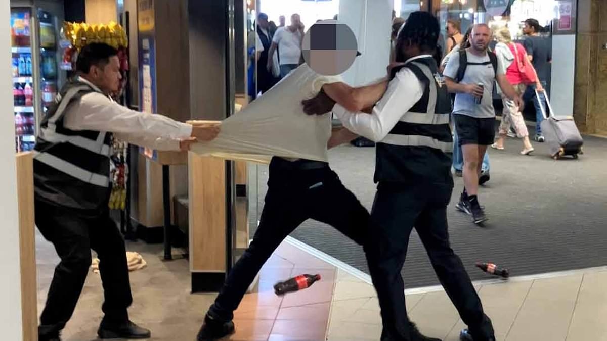 EXCLUSIVE Moment tide turns against Greggs shoplifters: Suspected thief is stopped in his tracks by bakery security guards and thrown out