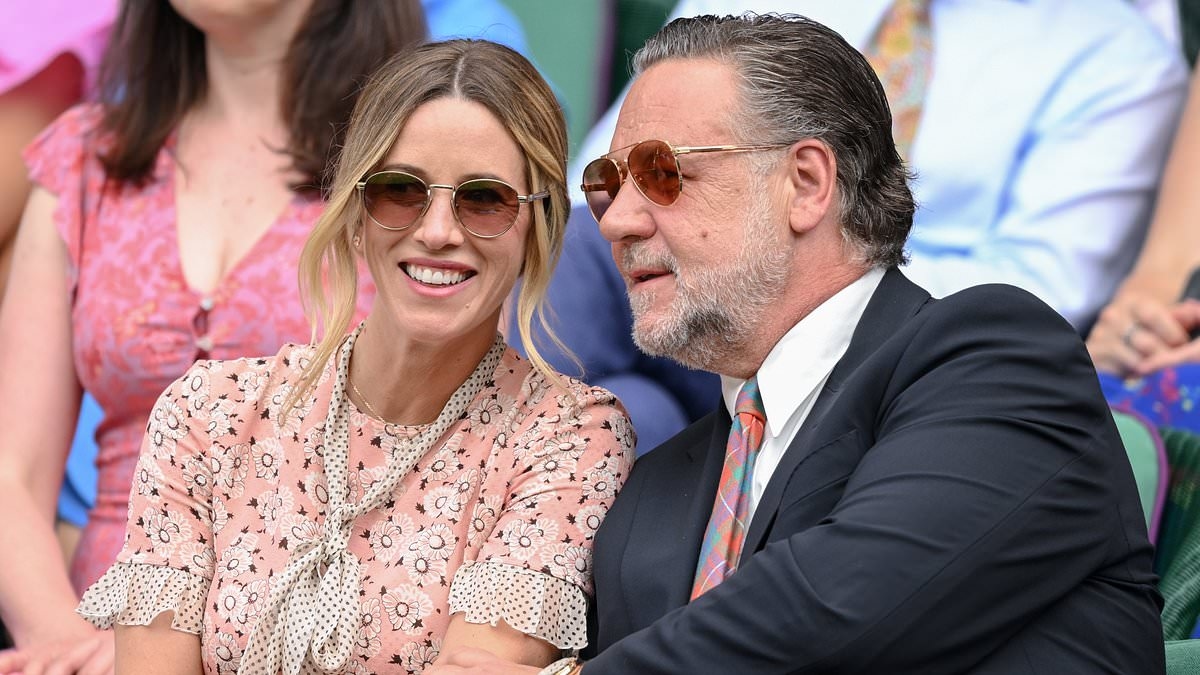 Russell Crowe's fiancée Britney Theriot flashes massive diamond engagement ring as the pair enjoy a tennis date at Wimbledon