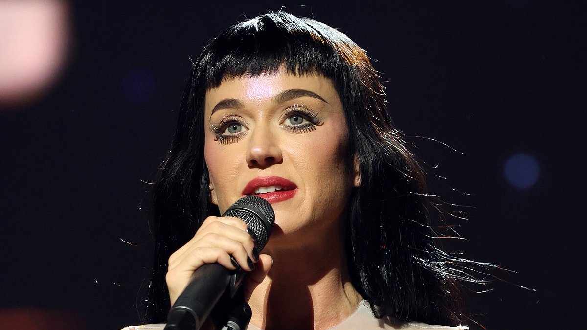 Katy Perry gets STUCK in flying metal sphere and nearly falls out mid-air... after crying amid Orlando Bloom split