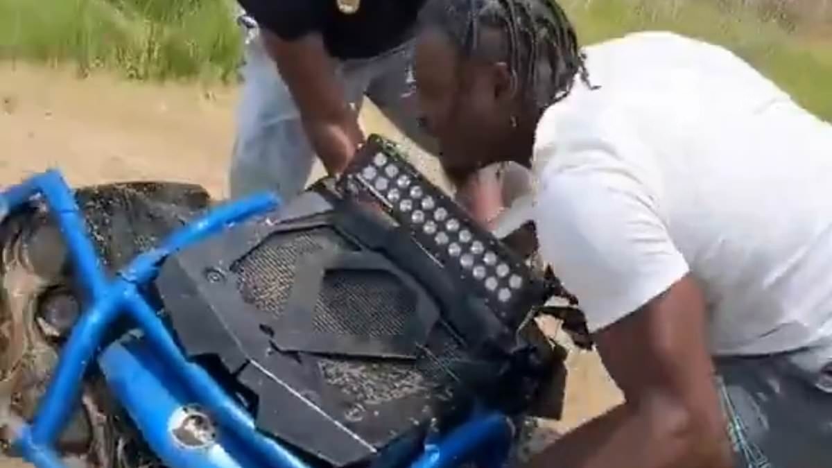 Incredible moment brave NFL star hops into thick mud to rescue stranded driver