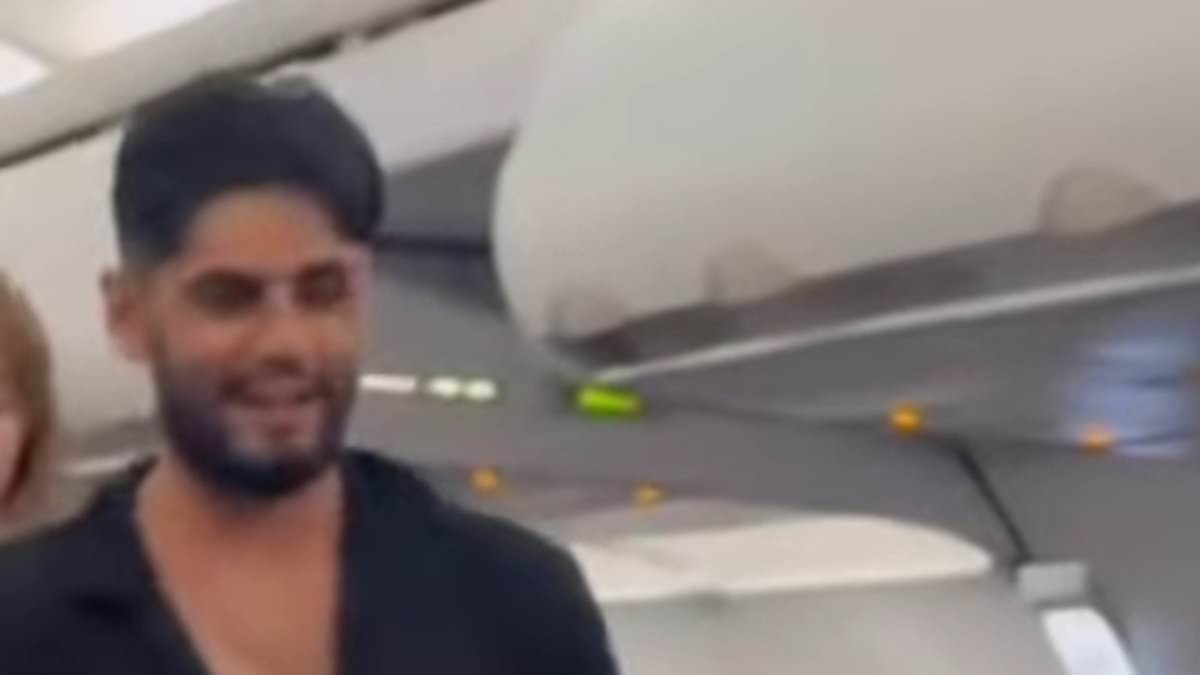 Meditating Frontier passenger, 21, seen CACKLING after mid-air brawl has smile wiped off his face on landing