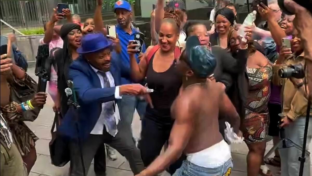 BREAKING NEWS Crazed Diddy fans are removed by riot police after spraying each other in baby oil outside court