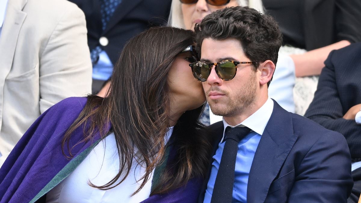 Stylish Priyanka Chopra and Nick Jonas put on a loved-up display as they share a kiss while watching the action on day three of Wimbledon