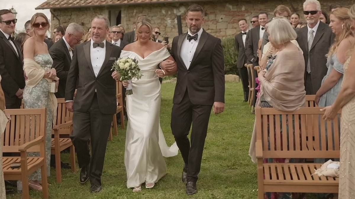 Emotional moment father of the bride invites her stepfather to join them mid-aisle walk