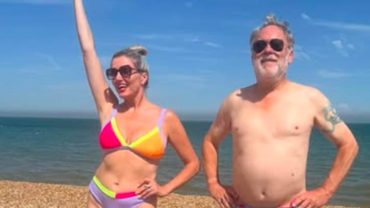 Vic Reeves' wife Nancy Sorrell, 50, shows off her figure in a colourful bikini as the pair share fun snaps hitting the beach in Kent