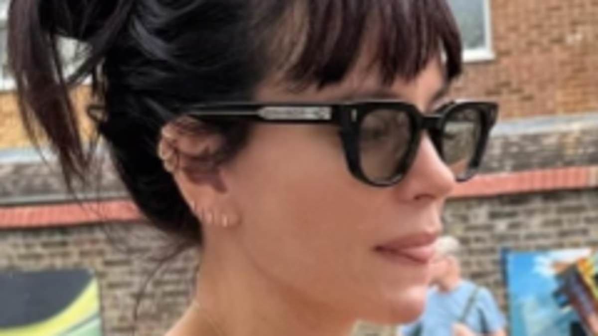 Lily Allen shows off the results of her boob job in a sheer lingerie and shorts