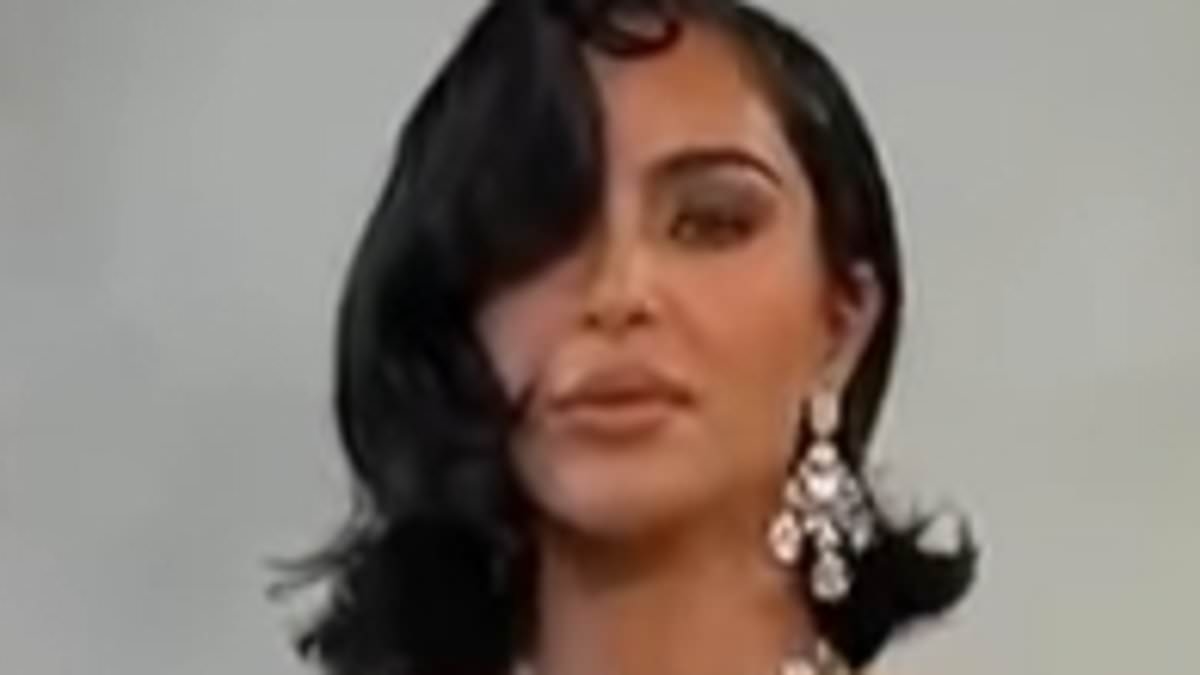 Kim Kardashian dons late Hollywood icon and jewel fanatic Elizabeth Taylor's £270k diamond earrings on the runway - adding fire to morbid claims she is 'obsessed with the dead'