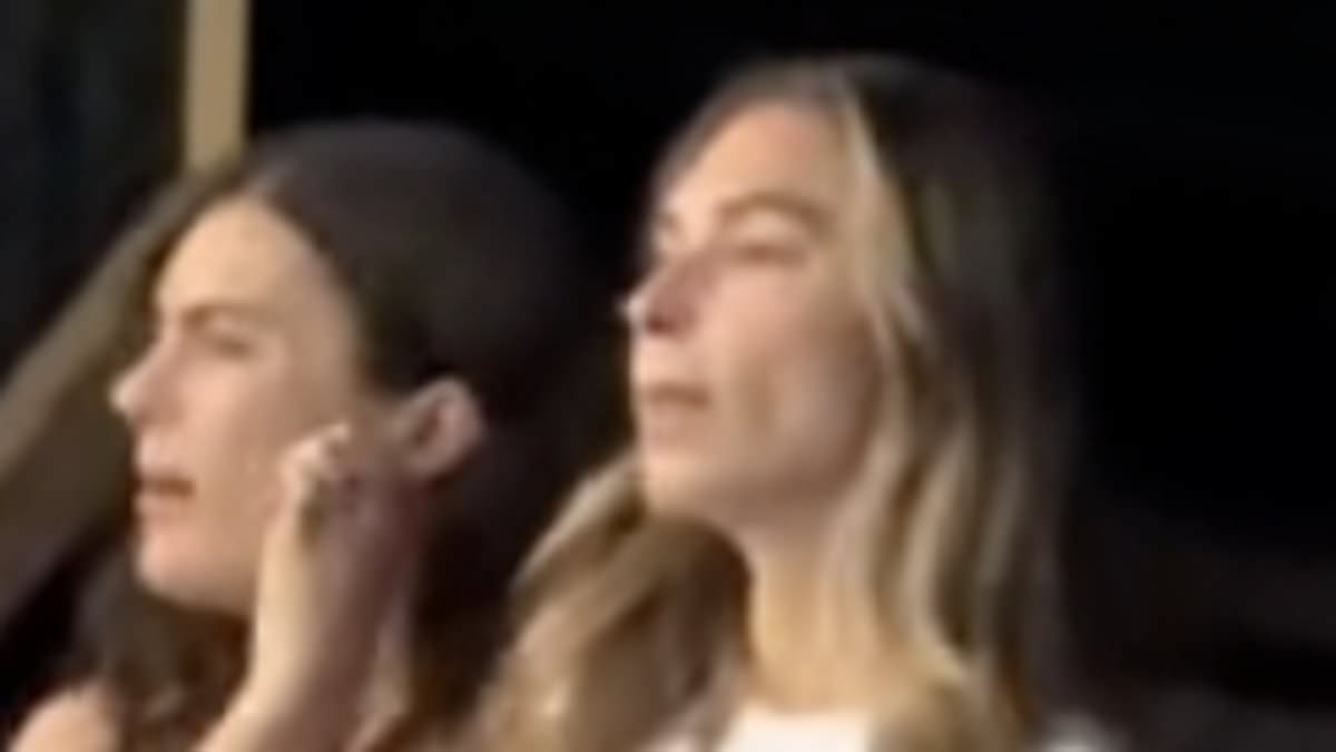 Smitten Zara McDermott shows her support for boyfriend Louis Tomlinson as sings along at his concert in Zurich