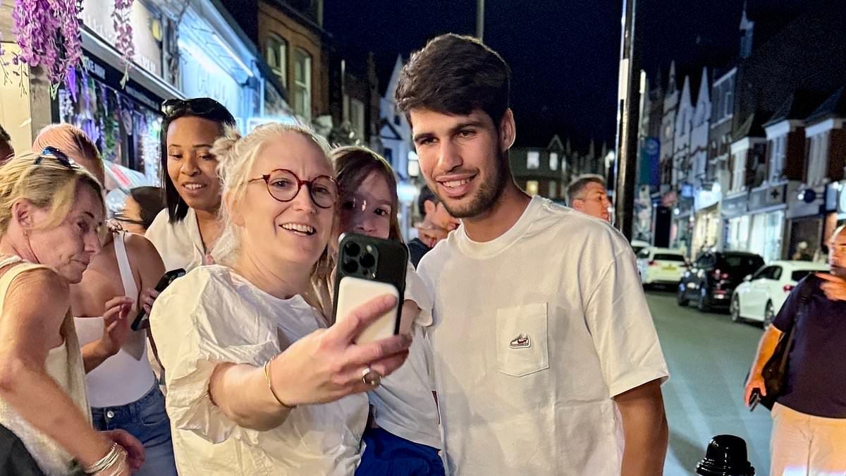 Carlos Alcaraz gets a pizza the action with fans as defending Wimbledon champion dines out in London ahead of men's final clash at SW19