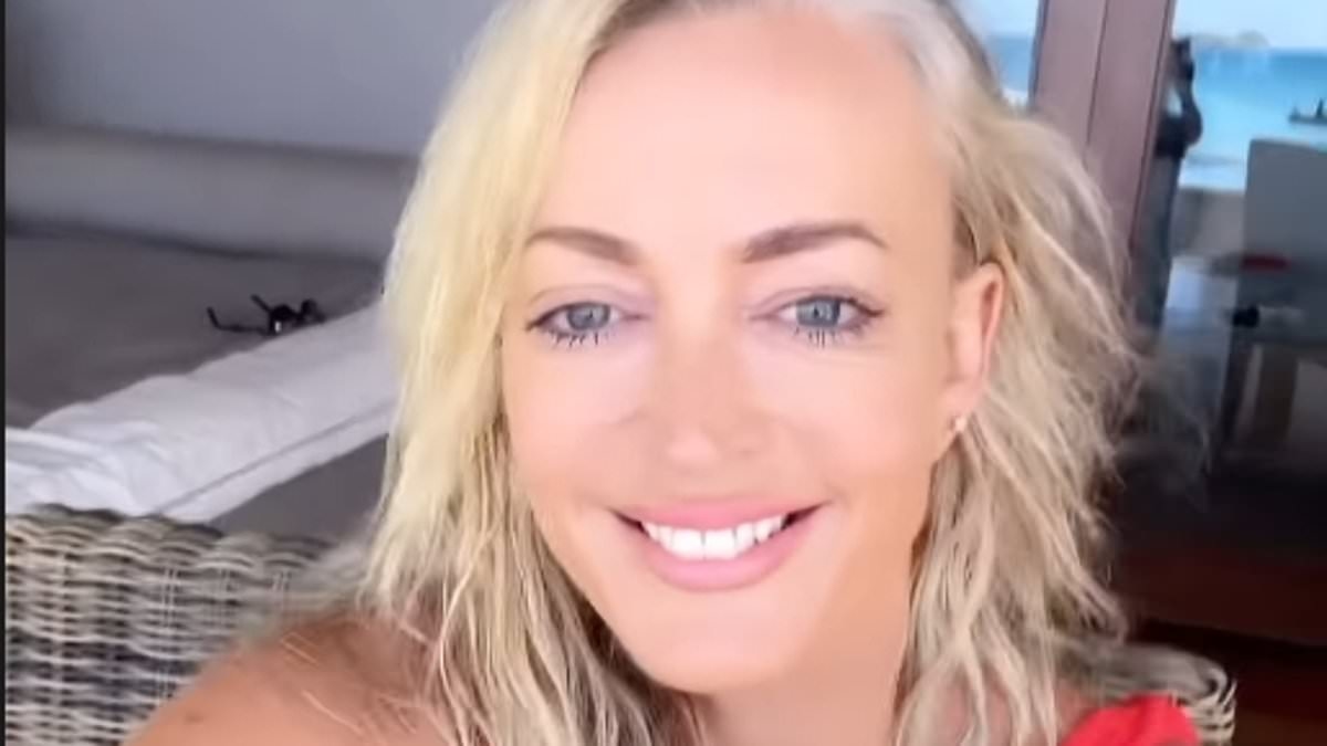Beach babe! Jackie O Henderson, 50, sizzles in plunging red swimsuit as she enjoys lavish Fiji getaway