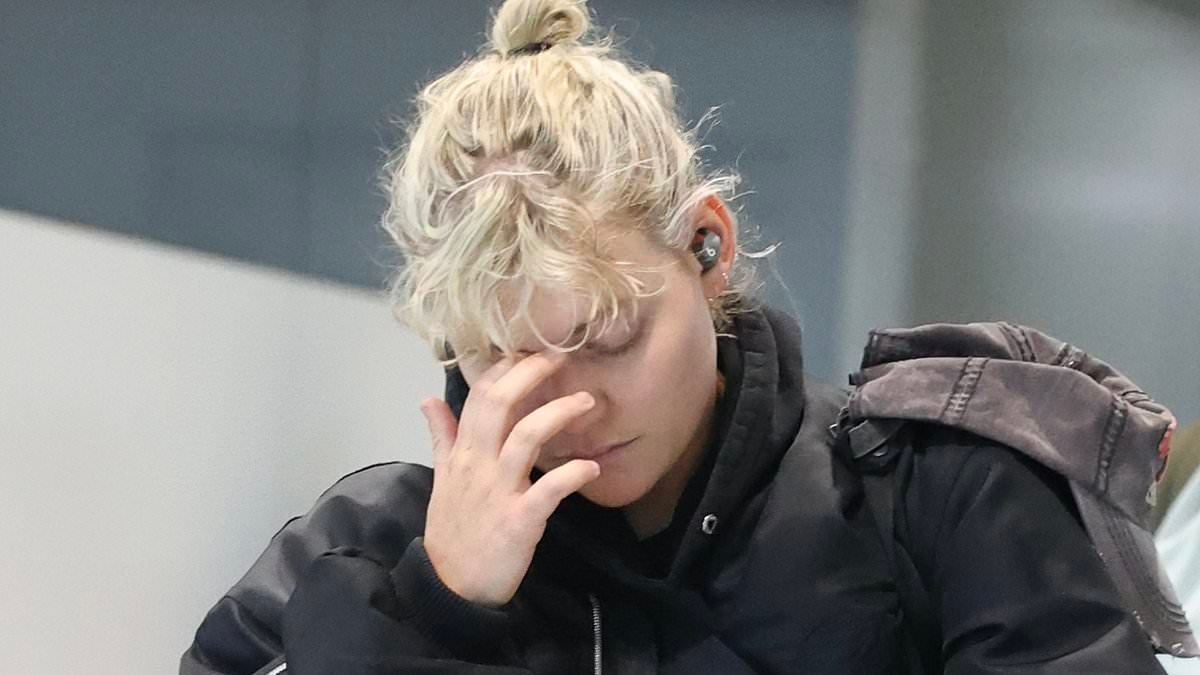 JoJo Siwa's ex Kath Ebbs looks downcast as they land at Sydney airport after 'obsessed' Chris Hughes discussed marriage plans with Dance Moms star