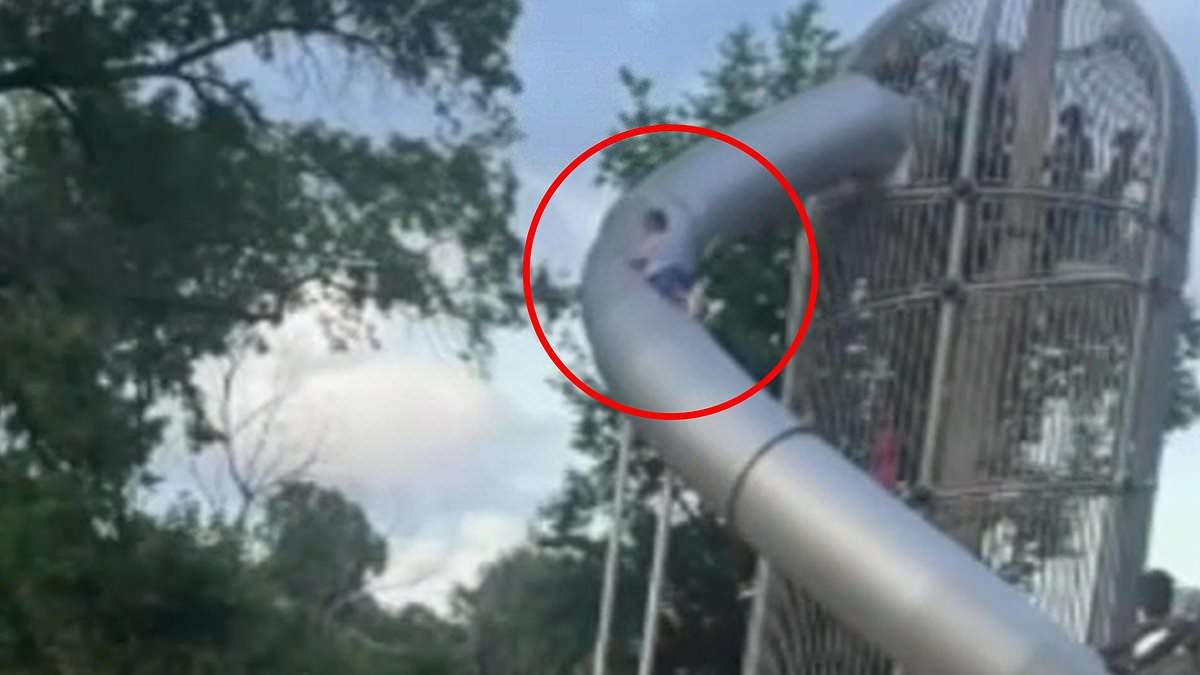 Horror after little boy climbs on the OUTSIDE of huge slide...then loses his grip