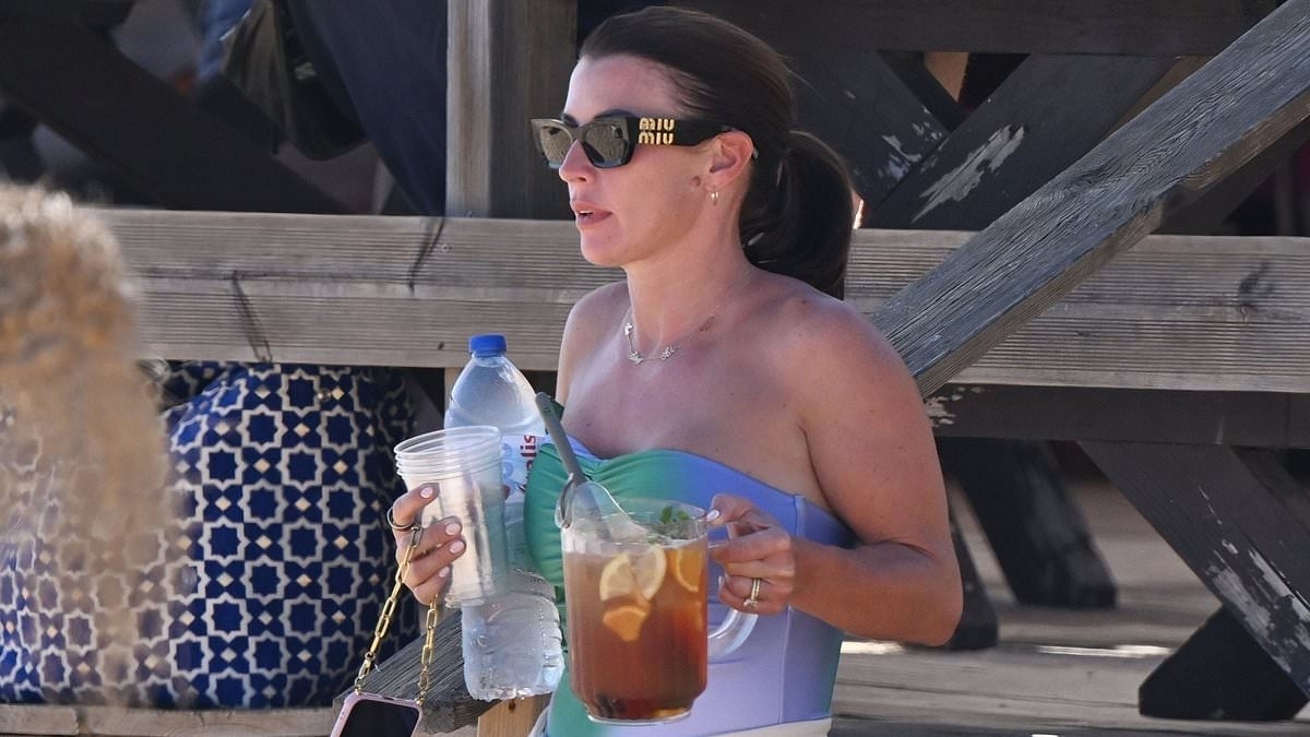Coleen Rooney enjoys the sunshine with a jug of Sangria in the Algarve as husband Wayne enjoys a night out with friends