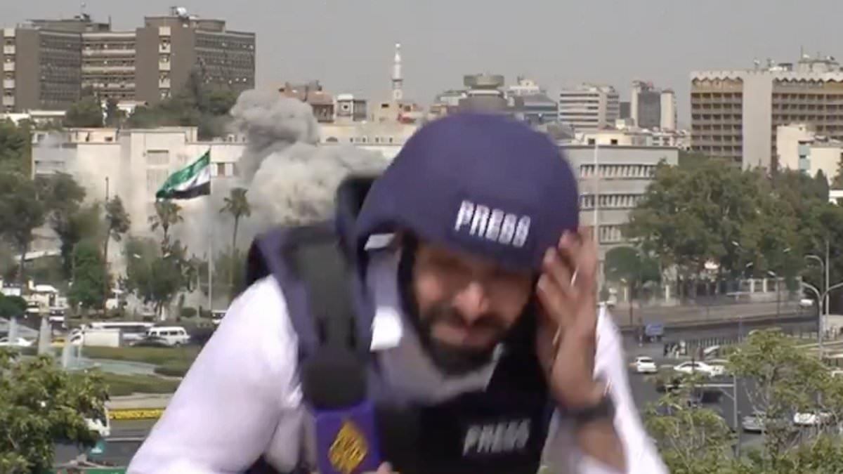 Moment Syrian TV journalists are sent running for cover during live broadcast as huge blasts from Israeli airstrikes erupt behind them