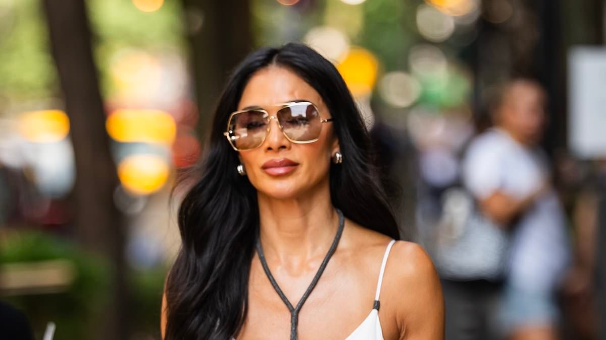 Nicole Scherzinger's plunging white linen maxi dress is the perfect holiday wardrobe stable - and we've found it on the high street