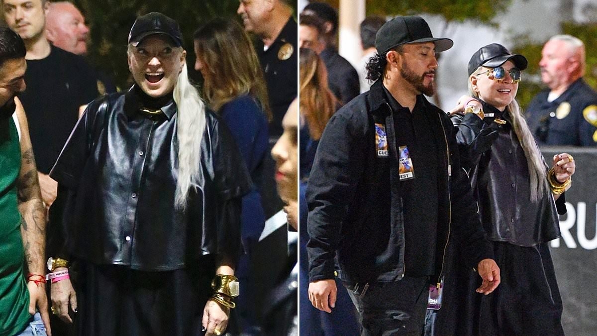 Sia, 49, fuels romance rumors with mystery man at Katy Perry concert in LA... after divorcing Dan Bernad