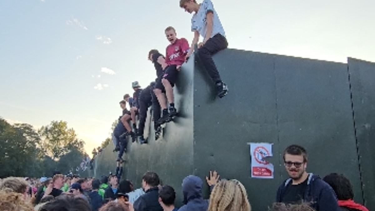 'You're my Wonderwall!': Oasis fans ignore security and climb barrier to try and see band play gig at Heaton Park