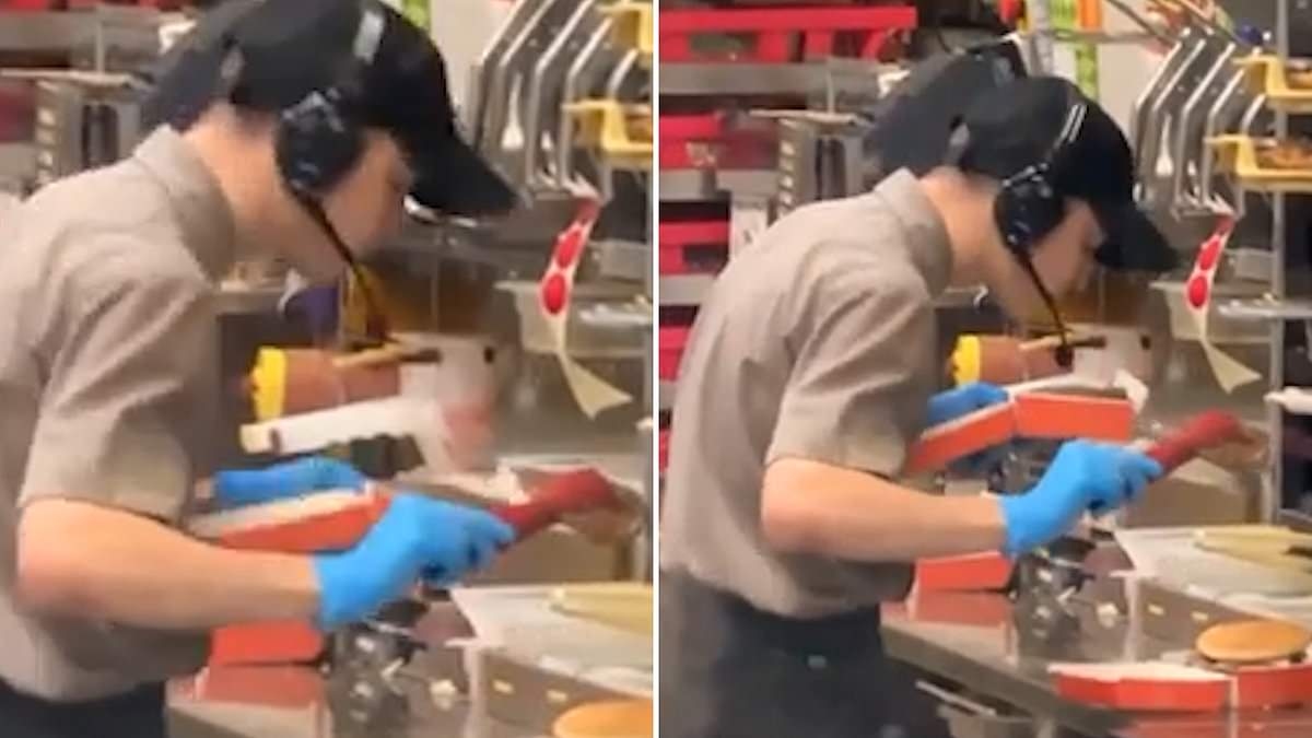 Disgusting moment fast food worker SPITS in food while packing customer's takeaway burger order