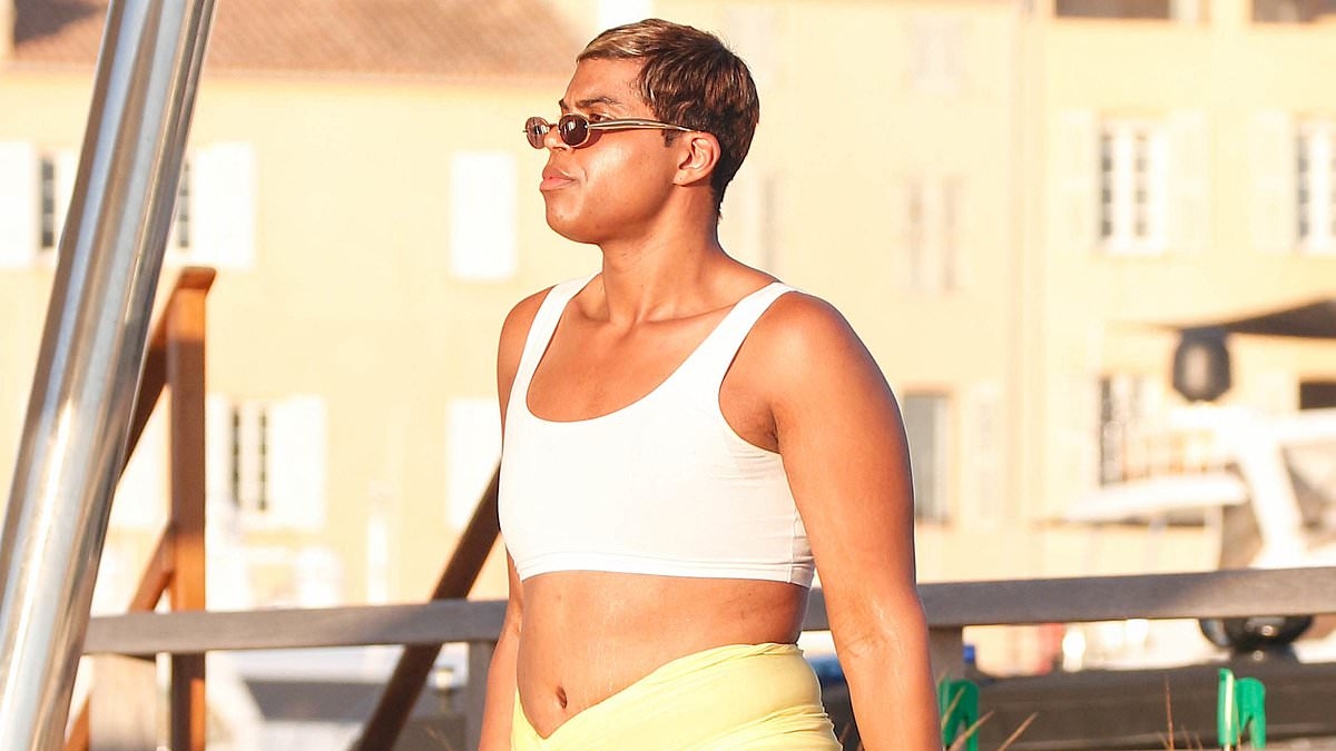 EJ Johnson flashes tummy in bra-top and sarong in Saint-Tropez on vacation with father Magic Johnson