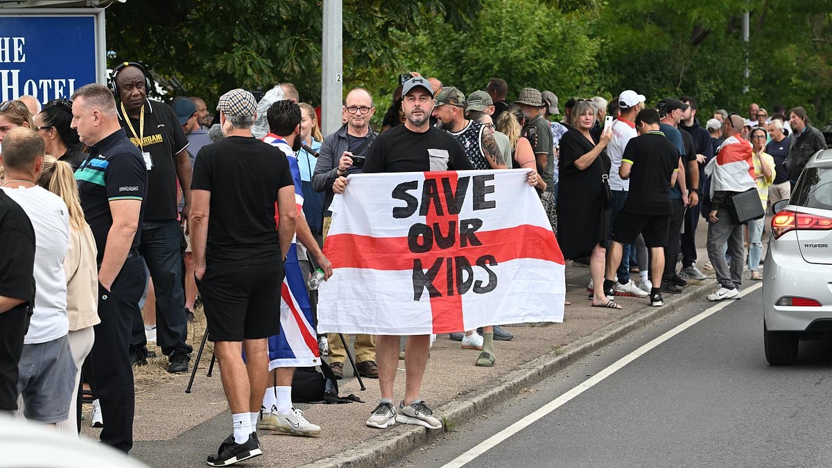 Angry residents with 'Save Our Kids' banners mass outside Essex asylum hotel after Ethiopian migrant appears in court accused of sexually assaulting 14-year-old schoolgirl