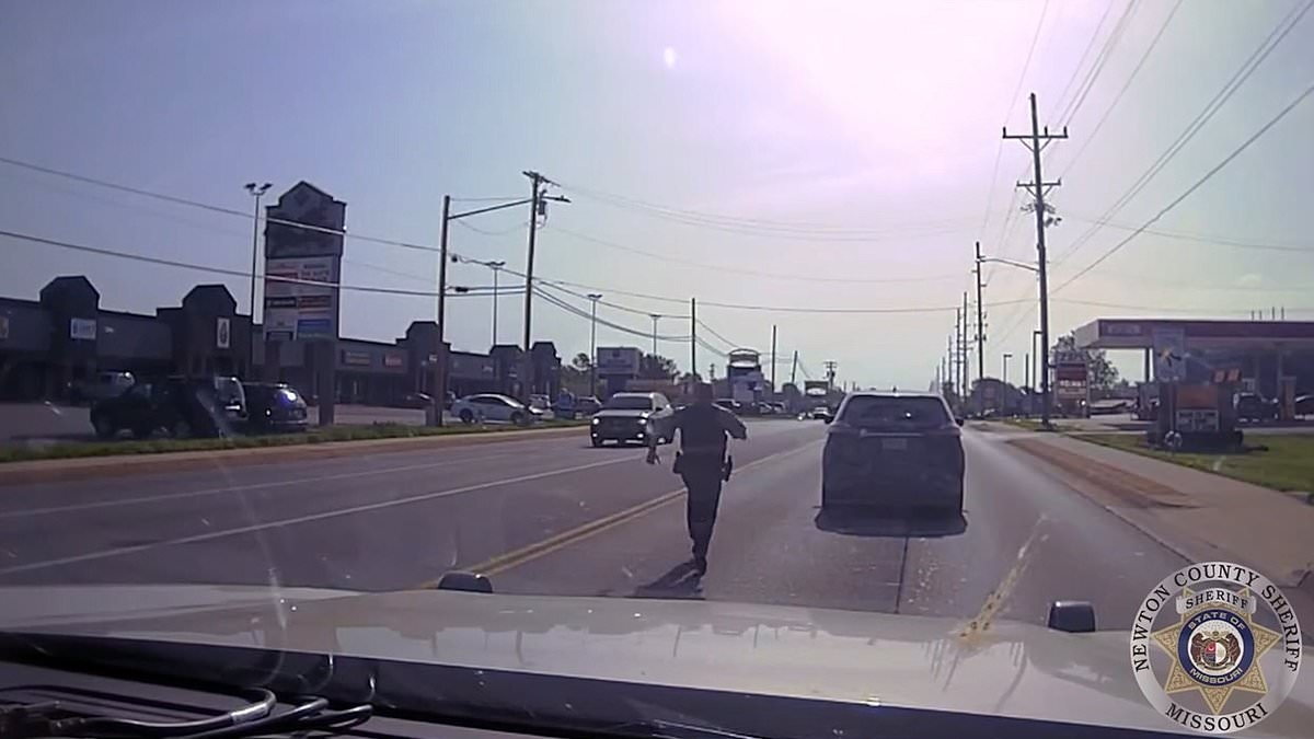 Heroic moment cop saves driver having heart attack behind the wheel of his car