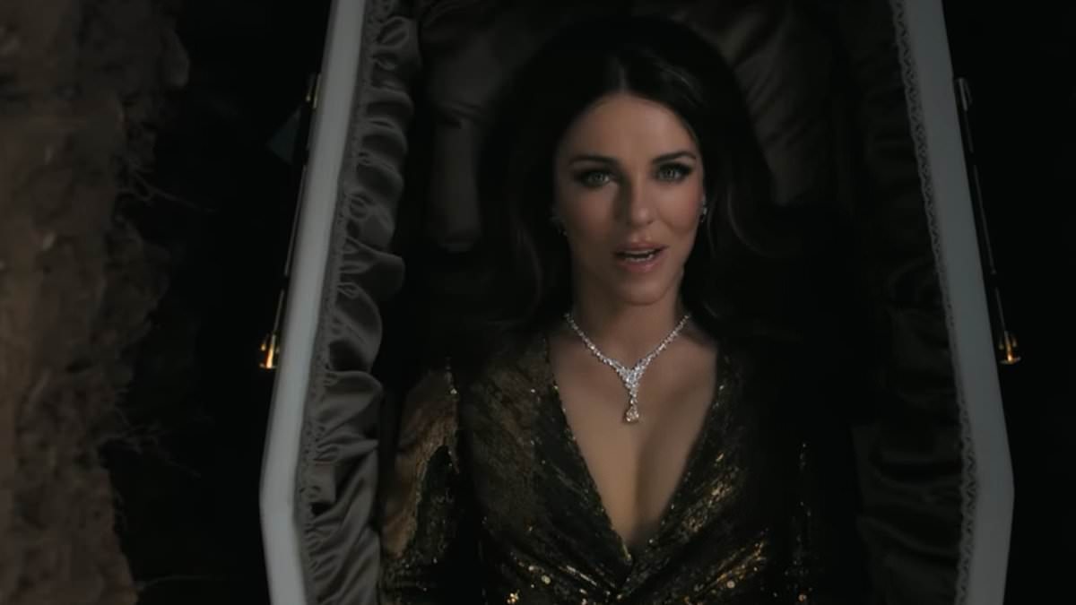 Elizabeth Hurley, 60, puts on a busty display in a plunging gown while laying in a COFFIN in eerie new trailer for Traitors copycat show The Inheritance