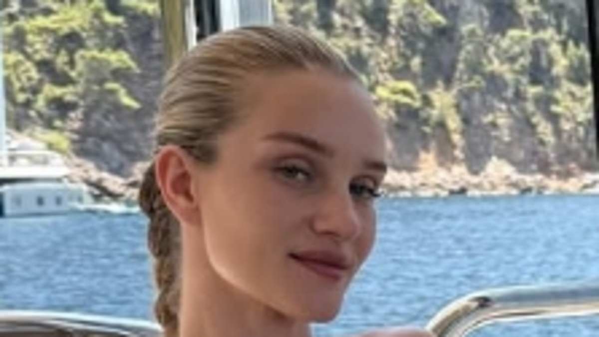Rosie Huntington-Whiteley shows off her incredible figure in a white bikini as she posts rare family snaps with her fiance Jason Statham and their kids during lavish Positano boat trip