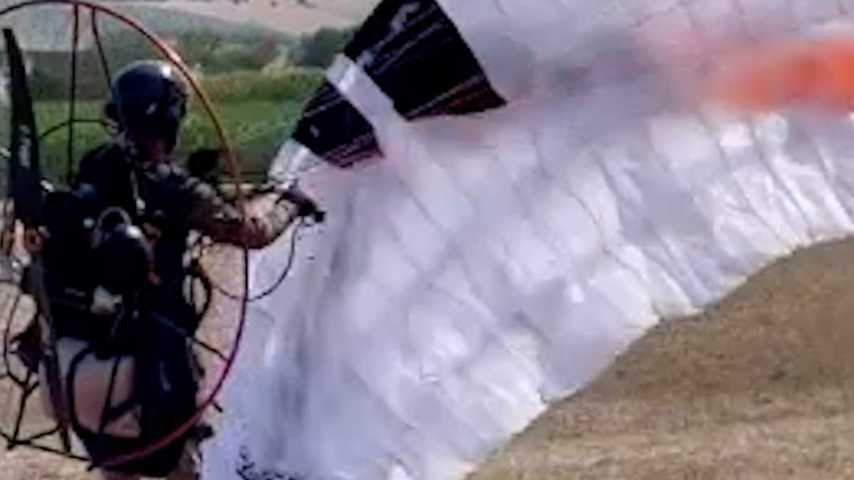 Felix Baumgartner's heartbroken widow shares footage of him taking off on doomed paraglider flight - as she reveals how she held daredevil's hand as he lost battle for life